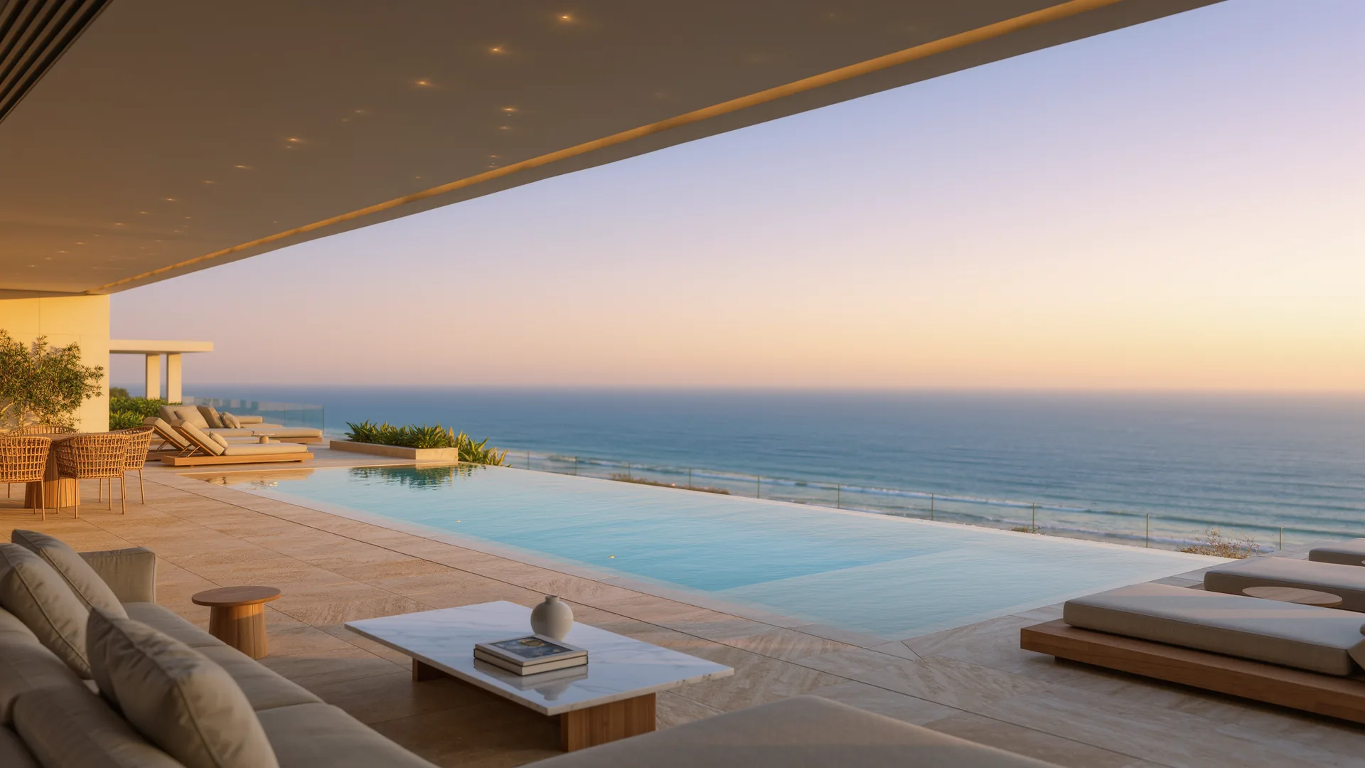 Modern villa terrace with an infinity pool above the Mediterranean at dusk