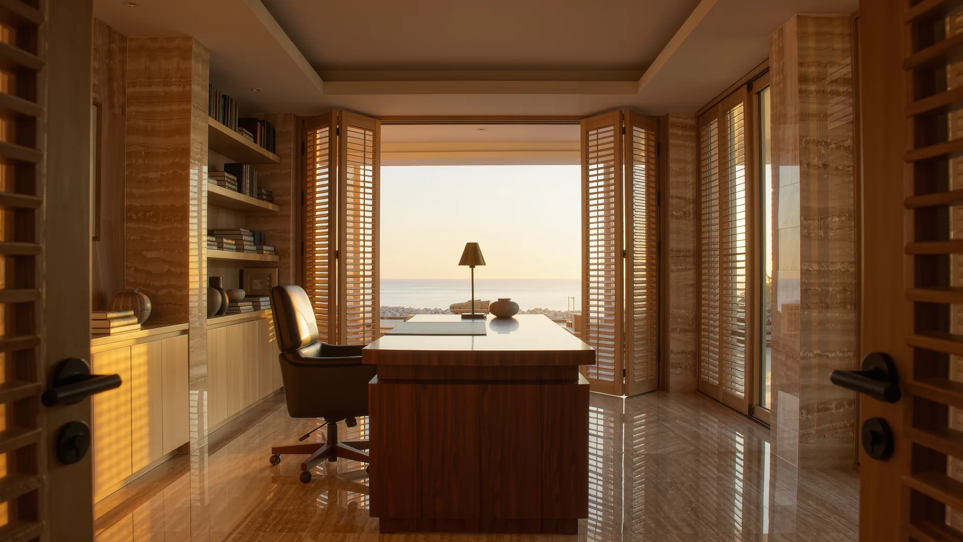 Bright private consulting room with a wooden desk and shutters