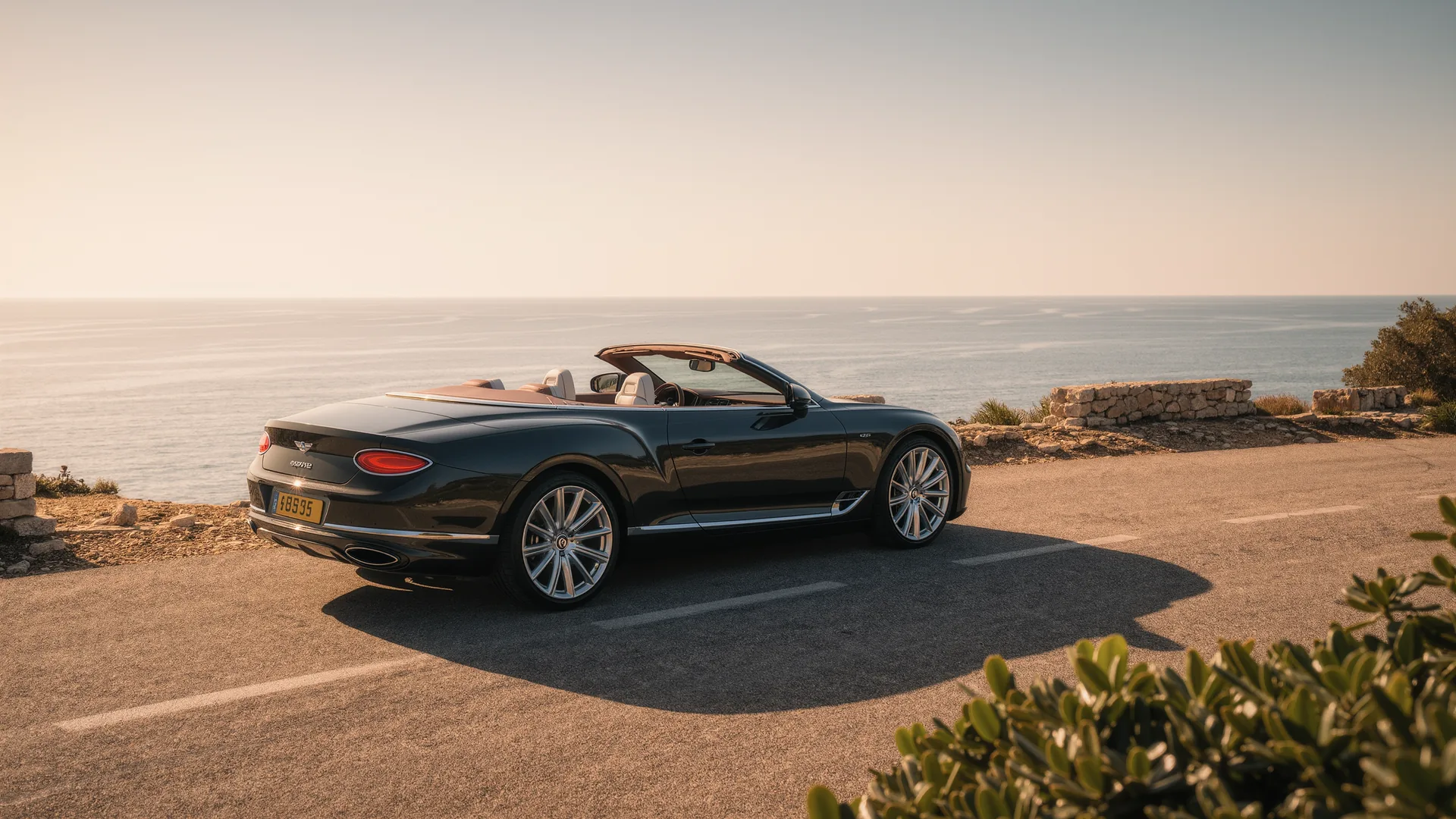 Convertible parked on a coastal road above the sea in Mallorca