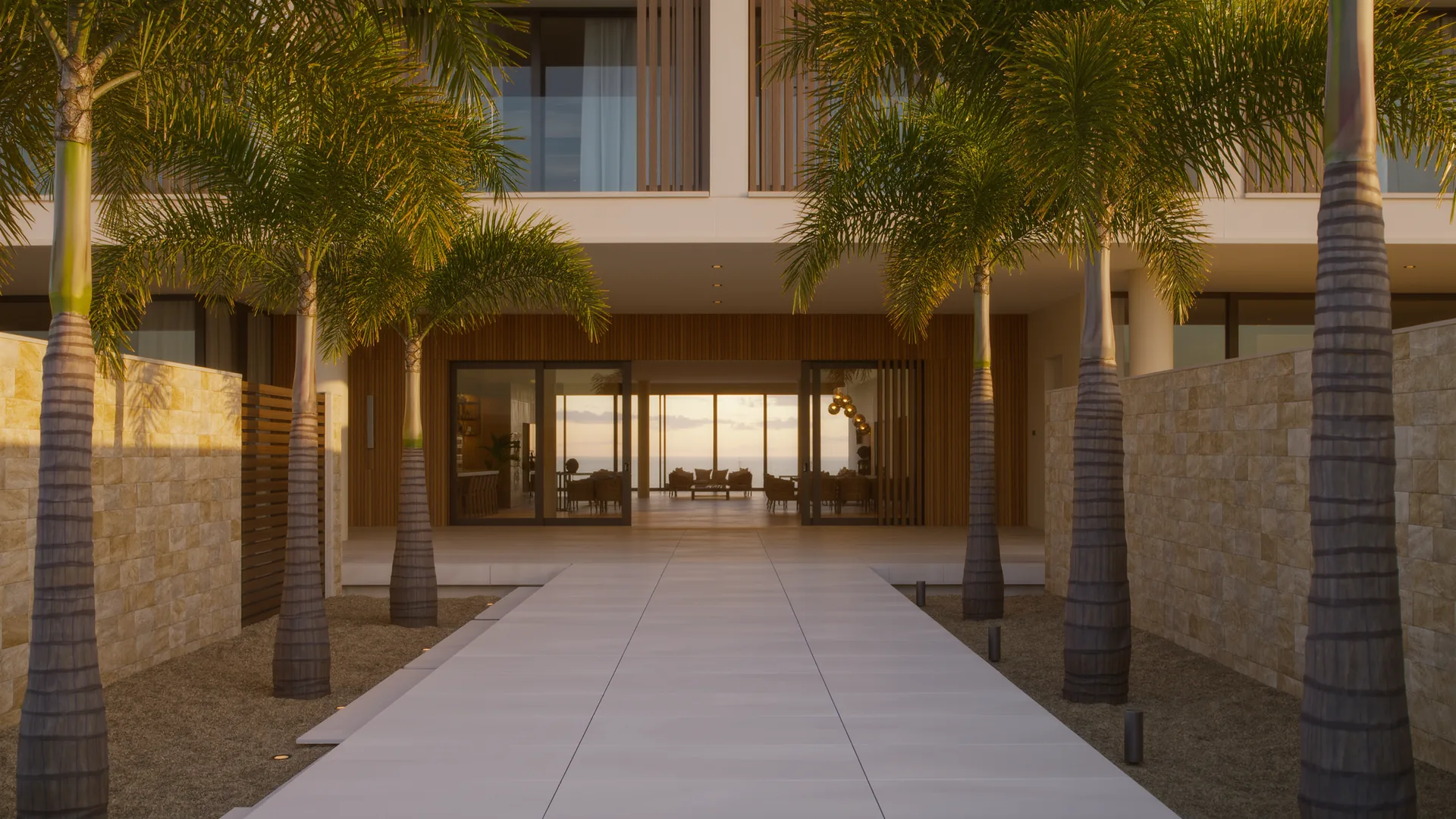 Apartment building courtyard with palms and a clean tiled walkway in morning light