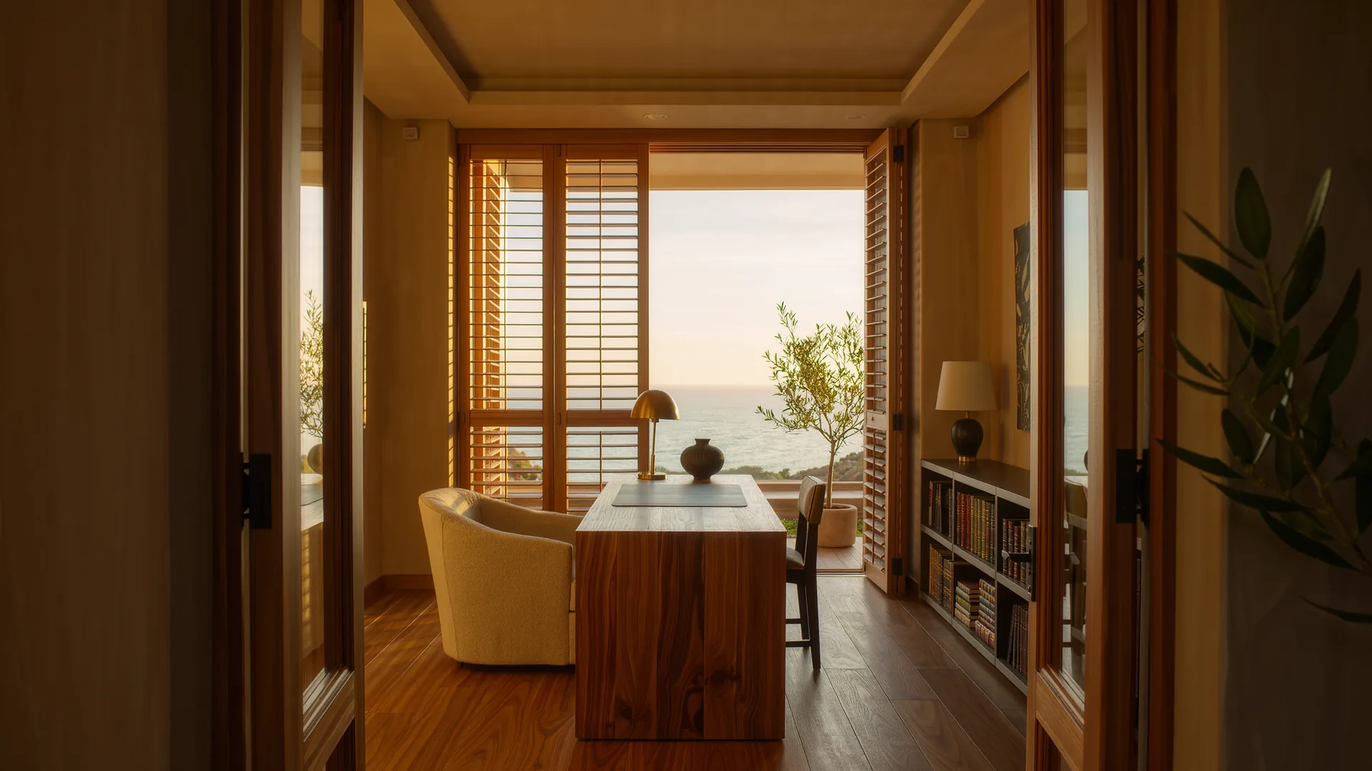 Bright private consulting room with a wooden desk and shutters
