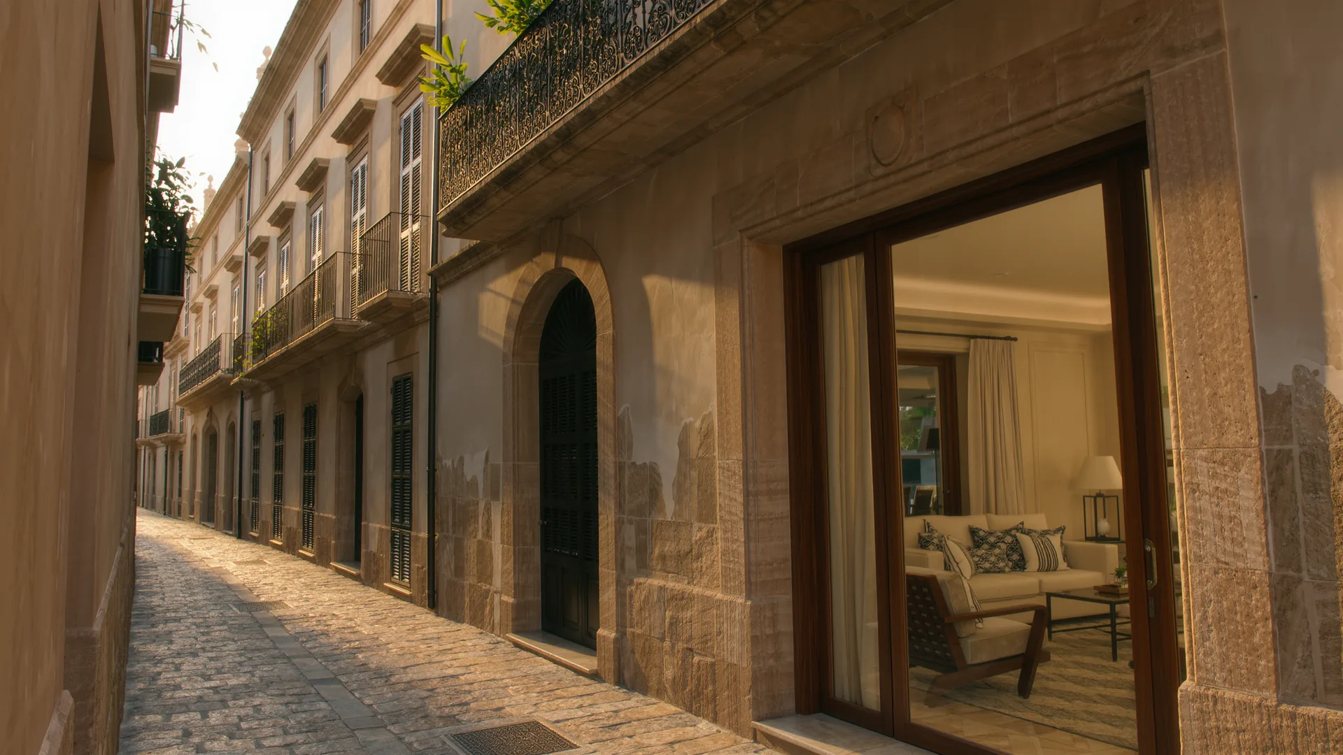 Old town street in Palma with sandstone facades and wrought iron balconies