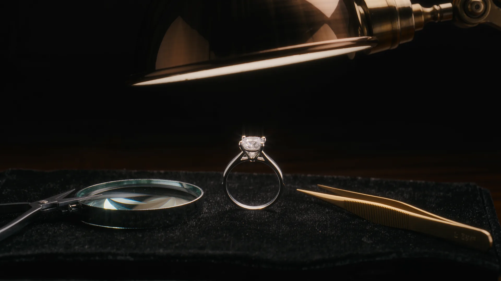 Mechanical watch movement open on a watchmaker's bench with fine screwdrivers